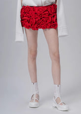 Schlankmachende kurze Hose mit Patchwork-Applikationen