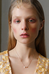 Perlenkette mit Herzmotiv