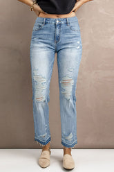 Jean taille haute à jambe droite et effet usé