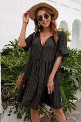 Robe à volants et col noué avec pompons