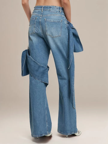 Jean taille basse avec nœuds papillon Pantalon large