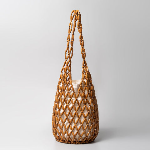 Sac à main découpé et creux avec design d'intérêt spécial et décoration de perles en bois Sac à bandoulière seau portable 