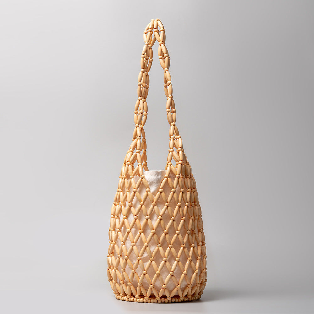 Sac à main découpé et creux avec design d'intérêt spécial et décoration de perles en bois Sac à bandoulière seau portable 