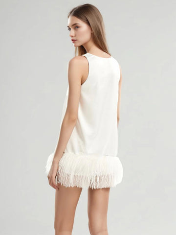 Gilet antitache avec bordure en plumes