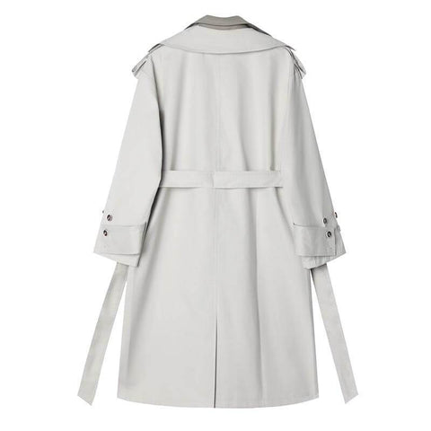 Le trench-coat épissé à manches longues Daisy